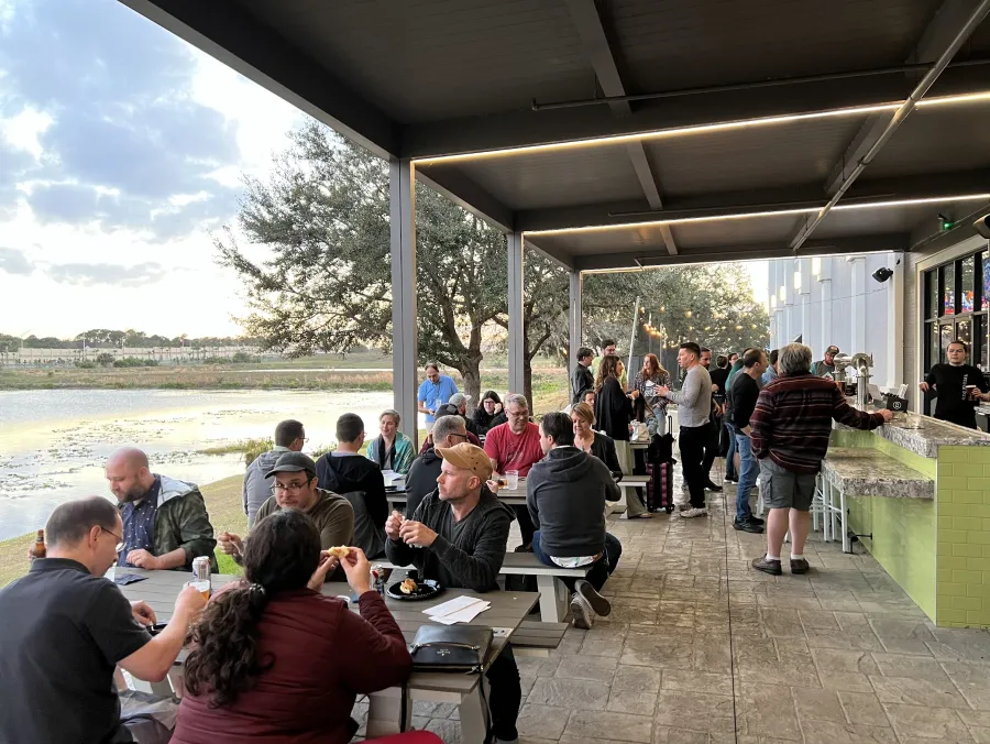 People hanging at an outside patio at Keg Social
